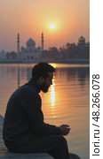 A lone mourner sitting by a river at twilight, his reflection blurred in the water as he whispers prayers for the martyrs of Karba. Стоковое AI-видео, аниматор Sergey Grishin / Фотобанк Лори