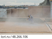 Blast cleaning, man working in the dust. Стоковое фото, фотограф Саблин Станислав / Фотобанк Лори