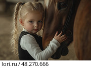 A young girl is hugging a horse. Стоковое AI-изображение, AI-художник Ярославский Максим / Фотобанк Лори