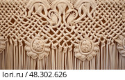 weaving macrame wall hanging. Стоковое AI-изображение, AI-художник Vectorwin / Фотобанк Лори
