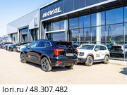 Haval Jolion and Haval Dargo vehicles next the showroom of official dealer. Редакционное фото, фотограф FotograFF / Фотобанк Лори