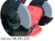 Красный электрический точильный станок на белом фоне. A red electric sharpener on a white background. Стоковое фото, фотограф Татьяна Д / Фотобанк Лори