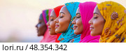 Concept: multiculturalism, equality, inclusivity. Design for diversity print: a row of women with closed eyes, wearing colorful hijab. Стоковое AI-изображение, AI-художник Данила Большаков / Фотобанк Лори