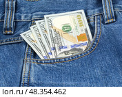 Доллары в кармане джинсов. Dollars bills in jeans pocket close-up. Стоковое фото, фотограф Татьяна Д / Фотобанк Лори