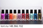 mini nail polish bottles ai generated. Стоковое AI-изображение, AI-художник Vectorwin / Фотобанк Лори