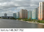 Picturesque Embankment and new modern residential area of Pavshinsky floodplain on Moscow River on spring day. Редакционное фото, фотограф Валерия Попова / Фотобанк Лори