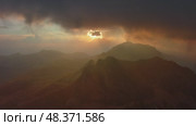 Sunset mountains and dramatic clouds. Стоковое видео, видеограф Михаил Коханчиков / Фотобанк Лори