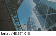Skyline view of modern skyscrapers under blue sky. Стоковое видео, видеограф Михаил Коханчиков / Фотобанк Лори