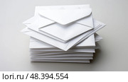 stack white background mail ai generated. Стоковое AI-изображение, AI-художник Vectorwin / Фотобанк Лори