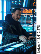 A Musician Playing a Keyboard Synthesizer in a Modern Studio. Стоковое AI-изображение, AI-художник Данила Большаков / Фотобанк Лори
