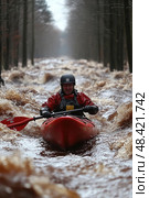 A kayaker skillfully maneuvers through a densely wooded area overtaken by rushing, muddy floodwaters after a rainstorm. Стоковое AI-изображение, AI-художник Данила Большаков / Фотобанк Лори