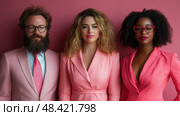 Three people dressed in coordinating pink outfits pose together in front of a matching backdrop, highlighting their fashion-forward choices. Стоковое AI-изображение, AI-художник Данила Большаков / Фотобанк Лори