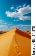 Desert adventure: vast sand dune against blue skies, footprints trace journey. Стоковое AI-изображение, AI-художник Данила Большаков / Фотобанк Лори