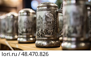 pewter beer steins ai generated. Стоковое AI-изображение, AI-художник Vectorwin / Фотобанк Лори