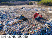 Top view of a huge dump of toxic and household waste. The problem of environmental pollution. Стоковое фото, фотограф Евгений Ткачёв / Фотобанк Лори