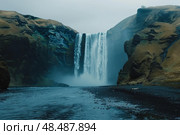 Skogafoss waterfall plunging into the icy river in iceland. Стоковое AI-изображение, AI-художник Иван Рябоконь / Фотобанк Лори