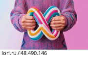 Infinity Symbol of Acceptance: A Rainbow Knit for Neurodiversity Celebration. Стоковое AI-изображение, AI-художник Данила Большаков / Фотобанк Лори