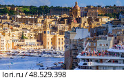 VALLETTA, MALTA - NOVEMBER 12, 2018 - The Grand Harbor Tricity bay, Birgu and Senglea islands with ships and boats in the port. Редакционное фото, фотограф Сергей Богомяко / Фотобанк Лори