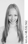 Smiling woman with long hair in a turtleneck, showcasing confidence and joy. Стоковое AI-изображение, AI-художник Екатерина Борисова / Фотобанк Лори