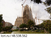 Barcelona, Spain - March 18, 2025: Sagrada Familia famous Church by Catalan architect Gaudi, building is begun in 1882. Редакционное фото, фотограф Яков Филимонов / Фотобанк Лори