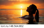 silhouette of woman relaxing in water at sunset, in the style of emotional sensitivity, serene faces, backlight, joyful and optimistic. Стоковое AI-изображение, AI-художник Sergey Grishin / Фотобанк Лори