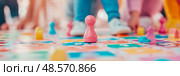 Family Fun: Colorful Boardgame Pieces and Players in Action, Encouraging Interaction, Playfulness, and Friendly Competition. Стоковое AI-изображение, AI-художник Данила Большаков / Фотобанк Лори