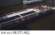 Russia, Saint Petersburg, May 01, 2025-Passenger boat navigating moika river with tourists enjoying cityscape. Редакционное видео, видеограф Андрей Знаменский / Фотобанк Лори