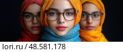 Three women display vibrant hijabs and glasses, highlighting their unique styles and camaraderie against a striking dark backdrop. Стоковое AI-изображение, AI-художник Данила Большаков / Фотобанк Лори