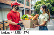 Man and Woman Wearing Masks Holding Box of Food. Generative AI. Стоковое AI-изображение, AI-художник Roman Zavorotny / Фотобанк Лори