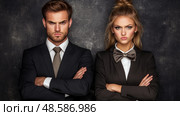 Corporate Grudge: A Portrait of Two Frustrated Professionals in Formal Attire with Crossed Arms, Ready to Confront a Challenge. Стоковое AI-изображение, AI-художник Данила Большаков / Фотобанк Лори