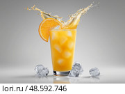 Refreshing orange drink splashing from glass with ice cubes. Освежающий апельсиновый напиток плещется в стакане с кубиками льда. Стоковое AI-изображение, AI-художник Katsiaryna Repich / Фотобанк Лори