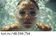 A woman dives below the surface of a clear pool, wearing goggles, her serene expression surrounded by bubbles and sunlight filtering through the water. Стоковое AI-изображение, AI-художник Данила Большаков / Фотобанк Лори