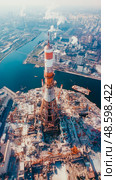 Industrial Ascendancy: An aerial exploration of urban landscape and technological advancement. Стоковое AI-изображение, AI-художник Данила Большаков / Фотобанк Лори