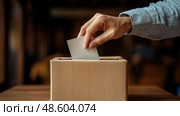 Someone is placing a blank ballot into a voting box during an election, highlighting civic engagement and participation in democracy. Стоковое AI-изображение, AI-художник Данила Большаков / Фотобанк Лори