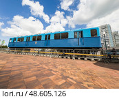 Side view of the first subway car at the exhibition dedicated to the 90th anniversary of the Moscow metro. Shooting from below at an angle. Russia. Moscow. 15.05.2025. Редакционное фото, фотограф Ярославский Максим / Фотобанк Лори