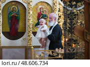 Belarus, Gomel, 25 March. 2018. The Prudhkovsky Church.The rite of baptism. Adoption of the Orthodox Faith. Редакционное фото, фотограф Лазаренко Светлана / Фотобанк Лори
