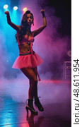 A woman in a bright costume dancing under light effects, front view, bright lighting, energetic color palette with neons and black. Стоковое AI-видео, аниматор Sergey Grishin / Фотобанк Лори