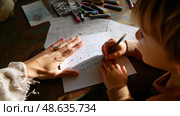 Child engages in creative writing while adult provides guidance at home during afternoon hours. Стоковое AI-изображение, AI-художник Сергей Толмачёв / Фотобанк Лори