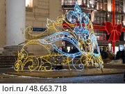 Новогодняя световая инсталяция у Большого театра. A vibrant light display in a city square showcases intricate designs, celebrating the winter festivities and attracting visitors during the holiday season (2022 год). Редакционное фото, фотограф Данила Большаков / Фотобанк Лори