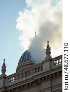 White smoke rises from the dome of the Sistine Chapel during the papal conclave, marking the election of a new pope. Crowds gather below, filled with anticipation and hope Generative AI. Стоковое AI-изображение, AI-художник Юлия Петровская / Фотобанк Лори
