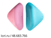 Two climbing holds with smooth rounded edges in blue and pink colors on white background. Identical shapes for hand or foot grip. Perfect for catalog or shop. Стоковое фото, фотограф Татьяна Терехина / Фотобанк Лори