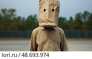 disguise paper bag over head ai generated. Стоковое AI-изображение, AI-художник Vectorwin / Фотобанк Лори