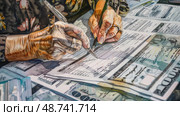 Hands write on official documents while handling various types of currency in a busy and organized office environment. Стоковое AI-изображение, AI-художник Данила Большаков / Фотобанк Лори