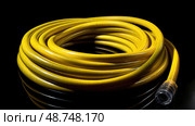 coiled water hose isolated ai generated. Стоковое AI-изображение, AI-художник Vectorwin / Фотобанк Лори