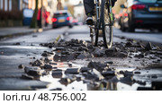 cyclist potholes road ai generated. Стоковое AI-изображение, AI-художник Vectorwin / Фотобанк Лори