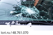 A shattered windshield captures the aftermath of an impact or accident, representing danger, road incidents, or metaphorically symbolizing a sudden life disruption. Стоковое AI-изображение, AI-художник Ольга Сухарева / Фотобанк Лори
