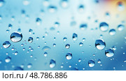 windowpane water droplets blue ai generated. Стоковое AI-изображение, AI-художник Vectorwin / Фотобанк Лори