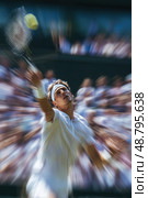 A tennis player is in the middle of a serve, with a crowd watching. Стоковое AI-изображение, AI-художник Ярославский Максим / Фотобанк Лори
