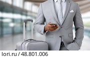 Businessman with Smartphone and Luggage in Modern Airport. Бизнесмен со смартфоном и багажом в современном аэропорту. Стоковое AI-изображение, AI-художник Katsiaryna Repich / Фотобанк Лори