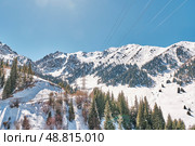Mountain spring landscape with high-voltage power line and road. Zailiyskiy Alatau mountain range (2024 год). Стоковое фото, фотограф Ирина Кононова / Фотобанк Лори